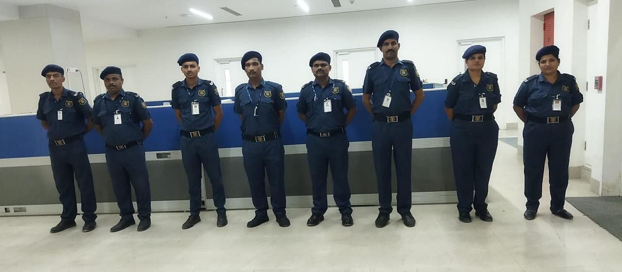 Industrial Security Force guards on duty inside a hospital reception
