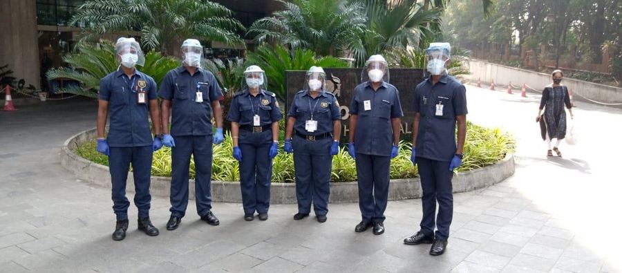 Industrial Security Force guards wearing masks, face shields and gloves on hospital duty
